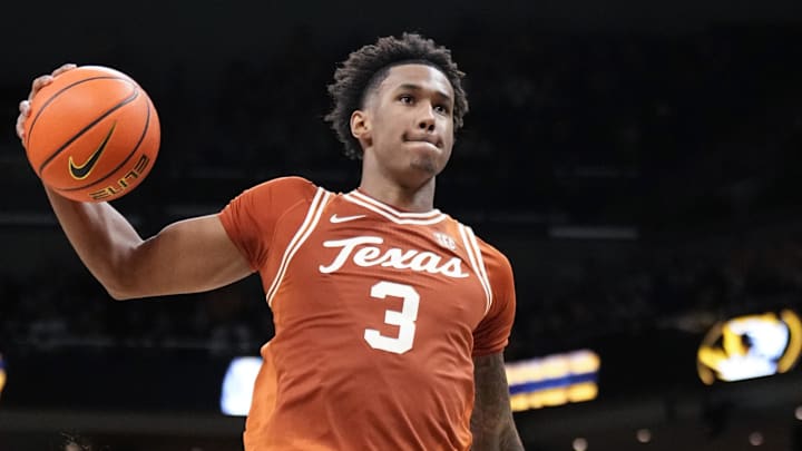 Feb 14, 2026; Columbia, Missouri, USA; Texas Longhorns forward Dailyn Swain (3) goes up for a shot as Missouri Tigers guard T.O. Barrett (5) defends during the second half of the game at Mizzou Arena. Mandatory Credit: Denny Medley-Imagn Images