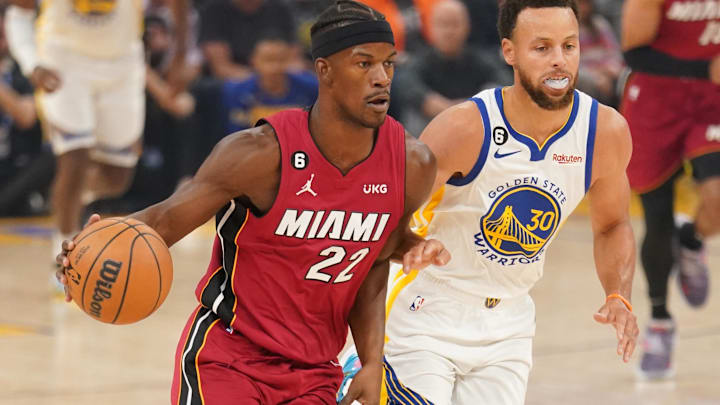 Oct 27, 2022; San Francisco, California, USA; Miami Heat forward Jimmy Butler (22) dribbles past Golden State Warriors guard Stephen Curry (30) in the first quarter at the Chase Center. Mandatory Credit: Cary Edmondson-Imagn Images