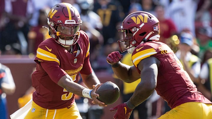 Sep 15, 2024; Landover, Maryland, USA; Washington Commanders quarterback Jayden Daniels (5) hand the ball off to running back Brian Robinson Jr. (8) in the second half against the New York Giants atCommanders Field. Mandatory Credit: Luke Johnson-Imagn Images
Sep 15, 2024; Landover, Maryland, USA; Washington Commanders quarterback Jayden Daniels (5) hand the ball off to running back Brian Robinson Jr. (8) in the second half against the New York Giants atCommanders Field. Mandatory Credit: Luke Johnson-Imagn Images