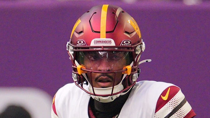 Washington Commanders quarterback Jayden Daniels drops back to pass against the Minnesota Vikings.