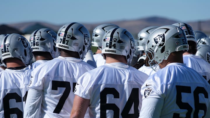 Jul 24, 2025; Henderson, NV, USA; Las Vegas Raiders players huddle during training camp at the Intermountain Healthcare Performance Center. Mandatory Credit: Kirby Lee-Imagn Images