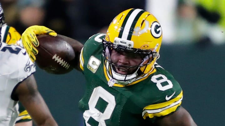 Green Bay Packers running back Josh Jacobs runs the ball against the Eagles.