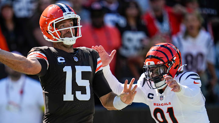 Cleveland Browns quarterback Joe Flacco (15) is chased through the end zone by Cincinnati Bengals defensive end Trey Hendrickson (91) in the fourth quarter of the NFL Week 1 game between the Cleveland Browns and the Cincinnati Bengals at Huntington Bank Field in Cleveland on Sunday, Sept. 7, 2025. The Bengals begin the season with a 17-16 win over the Browns.