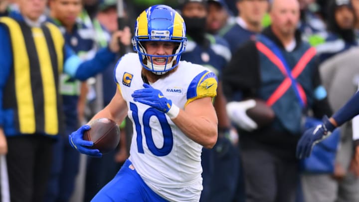 Nov 3, 2024; Seattle, Washington, USA; Los Angeles Rams wide receiver Cooper Kupp (10) carries the ball after a catch against the Seattle Seahawks during the first half at Lumen Field. Mandatory Credit: Steven Bisig-Imagn Images