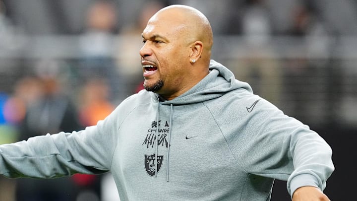 Dec 22, 2024; Paradise, Nevada, USA; Las Vegas Raiders head coach Antonio Pierce directs players on the field before a game against the Jacksonville Jaguars at Allegiant Stadium. Mandatory Credit: Stephen R. Sylvanie-Imagn Images