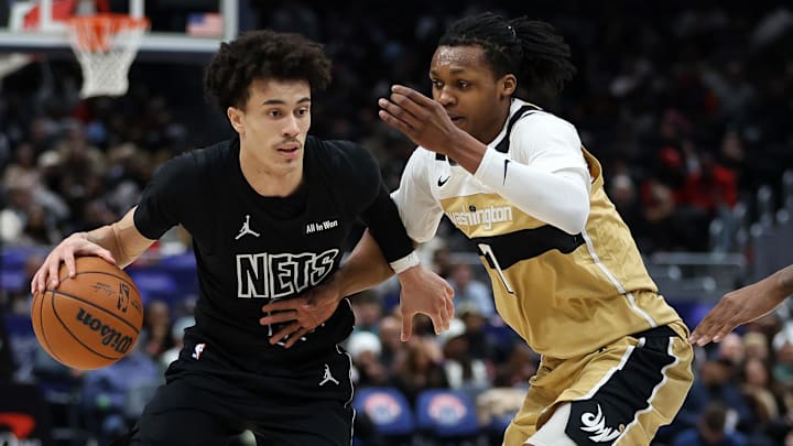 Jan 2, 2026; Washington, District of Columbia, USA; Brooklyn Nets guard Nolan Traore (88) drives past Washington Wizards guard Bub Carrington (7) during the first half at Capital One Arena. Mandatory Credit: Daniel Kucin Jr.-Imagn Images