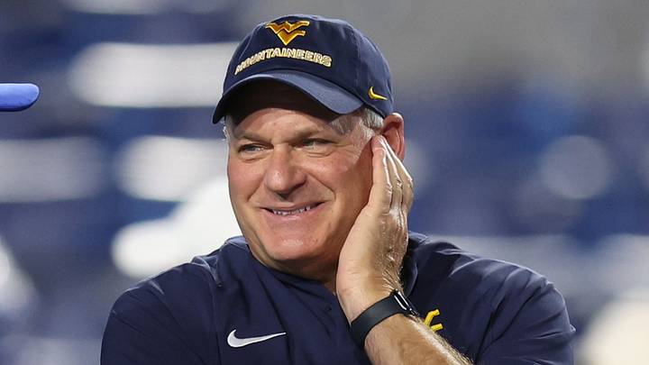 Oct 3, 2025; Provo, Utah, USA; West Virginia Mountaineers head coach Rich Rodriguez (right) speaks with Brigham Young Cougars head coach Kalani Sitake before the game at LaVell Edwards Stadium. Mandatory Credit: Rob Gray-Imagn Images Oct 3, 2025; Provo, Utah, USA; West Virginia Mountaineers head coach Rich Rodriguez (right) speaks with Brigham Young Cougars head coach Kalani Sitake before the game at LaVell Edwards Stadium. Mandatory Credit: Rob Gray-Imagn Images