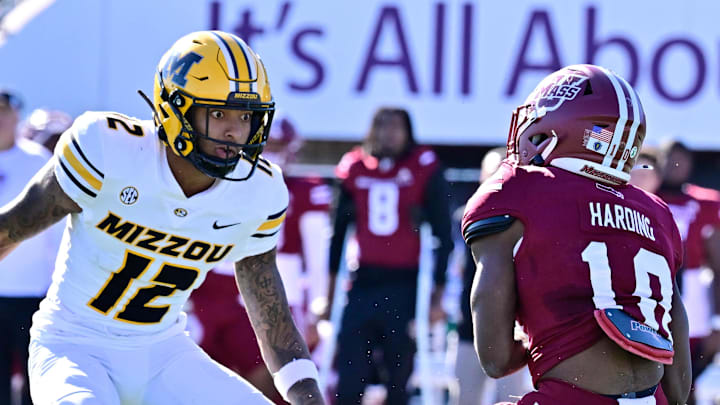 Oct 12, 2024; Amherst, Massachusetts, USA; Missouri Tigers cornerback Dreyden Norwood (12) looks to tackle Massachusetts Minutemen wide receiver T.Y. Harding (10) during the second half at Warren McGuirk Alumni Stadium. Oct 12, 2024; Amherst, Massachusetts, USA; Missouri Tigers cornerback Dreyden Norwood (12) looks to tackle Massachusetts Minutemen wide receiver T.Y. Harding (10) during the second half at Warren McGuirk Alumni Stadium.