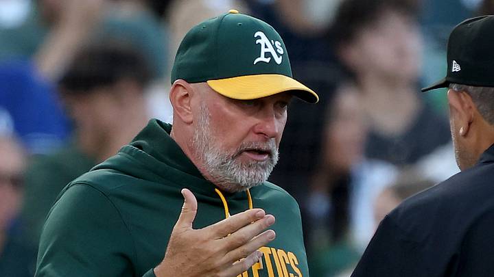 Aug 15, 2026; West Sacramento, California, USA; Athletics manager Mark Kotsay (7) talks with an umpire during the second inning against the Texas Rangers at Sutter Health Park. The initial call was overturned, resulting in a three-run home run hit by center fielder Henry Bolte (not pictured). Mandatory Credit: Dennis Lee-Imagn Images