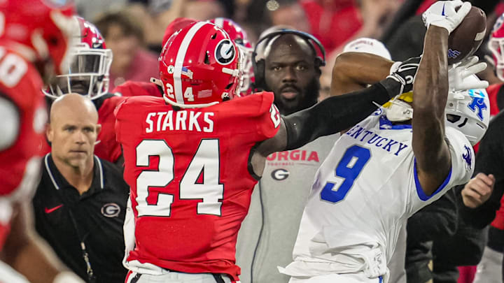 Oct 7, 2023; Athens, Georgia, USA; Kentucky Wildcats wide receiver Tayvion Robinson (9) is pushed out of bounds by Georgia Bulldogs defensive back Malaki Starks (24) after a catch during the first quarter at Sanford Stadium. Mandatory Credit: Dale Zanine-Imagn Images Oct 7, 2023; Athens, Georgia, USA; Kentucky Wildcats wide receiver Tayvion Robinson (9) is pushed out of bounds by Georgia Bulldogs defensive back Malaki Starks (24) after a catch during the first quarter at Sanford Stadium. Mandatory Credit: Dale Zanine-Imagn Images
