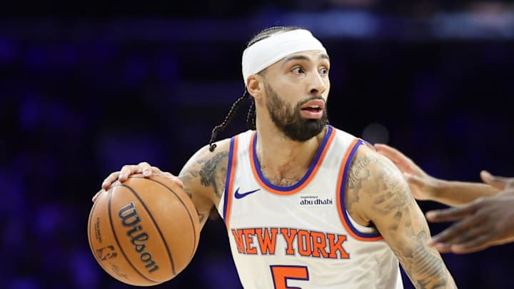 Feb 11, 2026; Philadelphia, Pennsylvania, USA; New York Knicks guard Jose Alvarado (5) controls the ball in front of Philadelphia 76ers guard Tyrese Maxey (0) and center Adem Bona (30) during the first half at Xfinity Mobile Arena. Mandatory Credit: Bill Streicher-Imagn Images