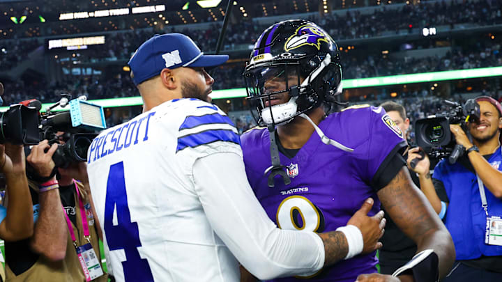 Dallas Cowboys quarterback Dak Prescott hugs Baltimore Ravens quarterback Lamar Jackson after a game at AT&T Stadium. Dallas Cowboys quarterback Dak Prescott hugs Baltimore Ravens quarterback Lamar Jackson after a game at AT&T Stadium.