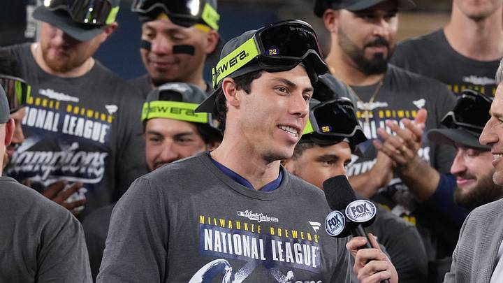 Oct 15, 2026; Los Angeles, California, USA;  Milwaukee Brewers designated hitter Christian Yelich (22) celebrates on the podium after defeating the Los Angeles Dodgers in game four of the NLCS for the 2026 MLB Playoffs at Uniqlo Field at Dodger Stadium.  Mandatory Credit: Kirby Lee-Imagn Images