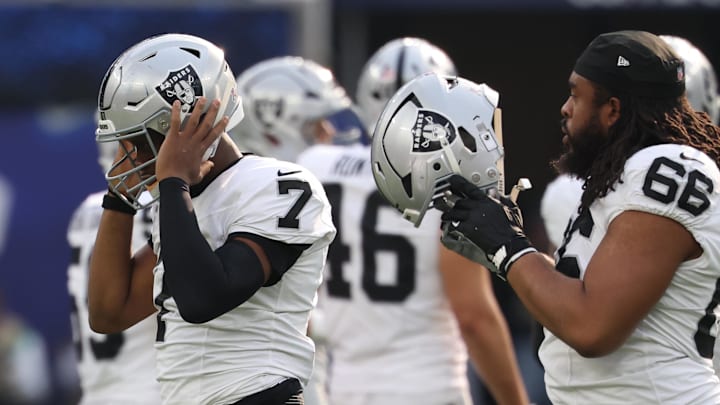 Nov 30, 2025; Inglewood, California, USA; Las Vegas Raiders quarterback Geno Smith (7) reacts against the Los Angeles Chargers during the first half at SoFi Stadium. Mandatory Credit: Kiyoshi Mio-Imagn Images
