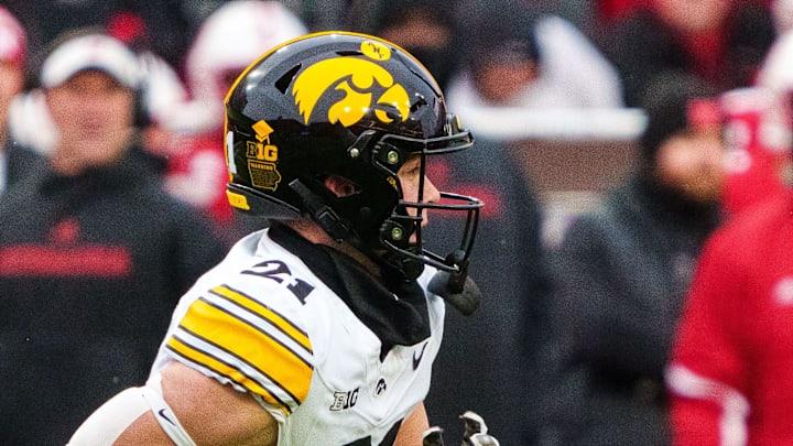 Nov 28, 2025; Lincoln, Nebraska, USA; Iowa Hawkeyes wide receiver Kaden Wetjen (21) runs against the Nebraska Cornhuskers during the third quarter at Memorial Stadium. Mandatory Credit: Dylan Widger-Imagn Images