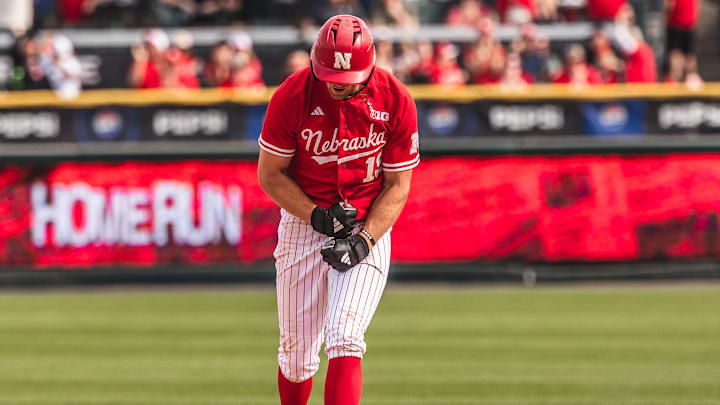 Nebraska shortstop Dylan Carey celebrates a home run as he rounds the bases against Iowa. Nebraska shortstop Dylan Carey celebrates a home run as he rounds the bases against Iowa.