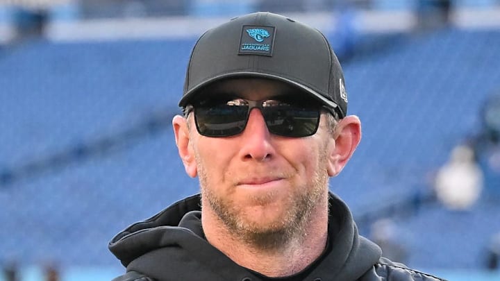 Nov 30, 2025; Nashville, Tennessee, USA;  Jacksonville Jaguars head coach Liam Coen smiles to the crowd as he walks of the field against the Tennessee Titans during the second half at Nissan Stadium. Mandatory Credit: Steve Roberts-Imagn Images