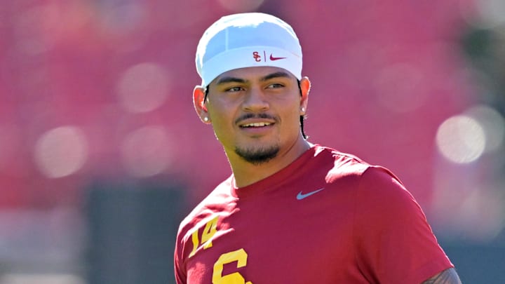 Oct 11, 2025; Los Angeles, California, USA;  USC Trojans quarterback Jayden Maiava (14) warms up prior to the game against the Michigan Wolverines at United Airlines Field at the Los Angeles Memorial Coliseum.