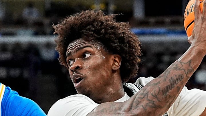 Michigan State forward Coen Carr (55) goes to the basket against UCLA center Xavier Booker (1) during the second half of Big Ten tournament quarterfinal at United Center in Chicago on Friday, March 13, 2026. Michigan State forward Coen Carr (55) goes to the basket against UCLA center Xavier Booker (1) during the second half of Big Ten tournament quarterfinal at United Center in Chicago on Friday, March 13, 2026.