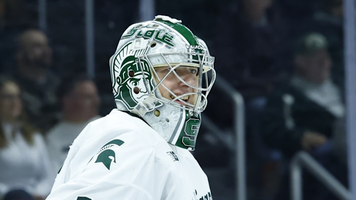 Michigan State Spartans goalie Trey Augustine talks with a referee during a game against the Michigan Wolverines on Friday, Dec. 5, 2025, at Munn Ice Arena.