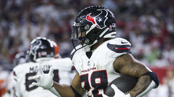 Sep 15, 2024; Houston, Texas, USA; Houston Texans running back Joe Mixon (28) runs with the ball during the third quarter against the Chicago Bears at NRG Stadium. Mandatory Credit: Troy Taormina-Imagn Images