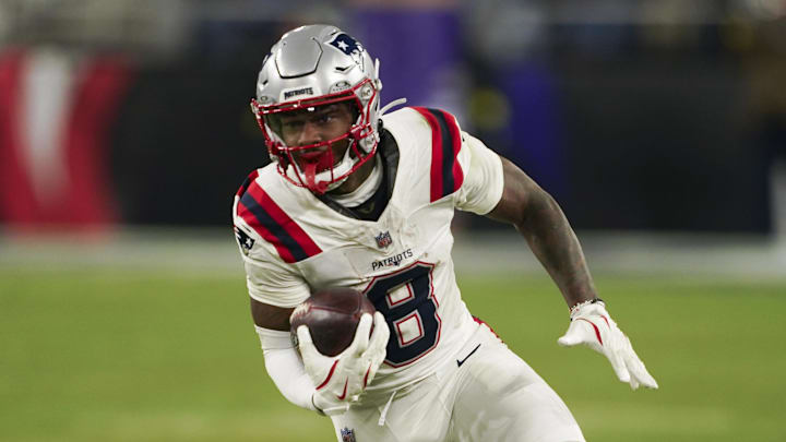 Dec 21, 2025; Baltimore, Maryland, USA;  New England Patriots wide receiver Stefon Diggs (8) runs the ball against the Baltimore Ravens during the second half of the game at M&T Bank Stadium. Mandatory Credit: Mitch Stringer-Imagn Images