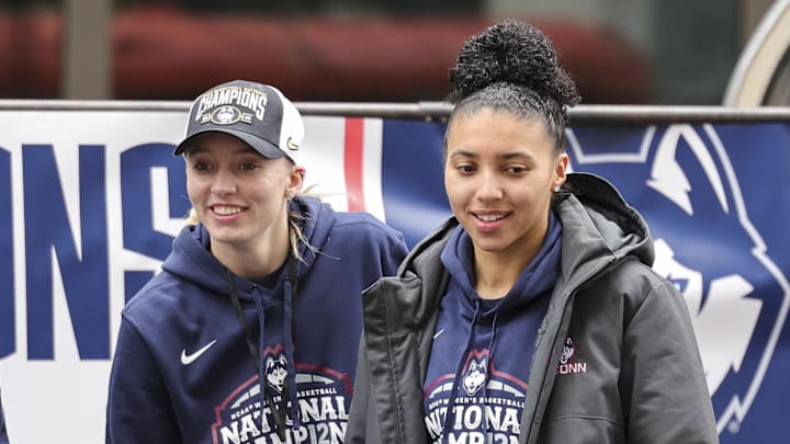 Apr 13, 2025; Hartford, CT, USA; UConn student-athlete Paige Bueckers and UConn student-athlete Azzi Fudd walk onto the stage during the Final Four Champions victory parade and rally outside of the XL Center in Hartford, CT. Mandatory Credit: Scott Rausenberger-Imagn Images Apr 13, 2025; Hartford, CT, USA; UConn student-athlete Paige Bueckers and UConn student-athlete Azzi Fudd walk onto the stage during the Final Four Champions victory parade and rally outside of the XL Center in Hartford, CT. Mandatory Credit: Scott Rausenberger-Imagn Images