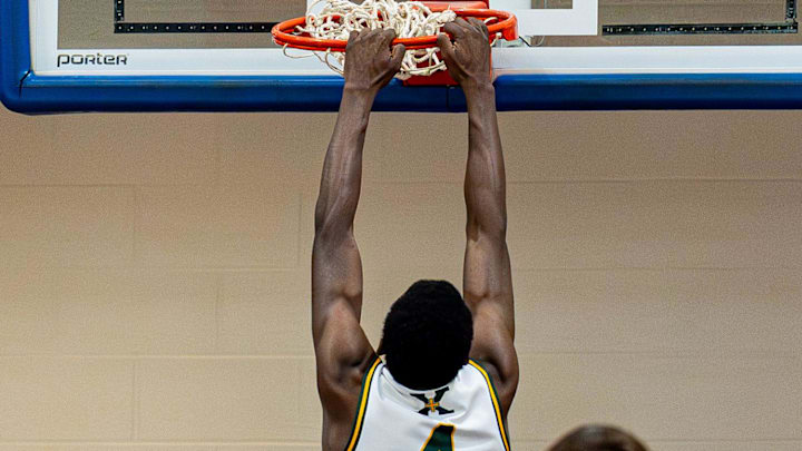 St. Xavier's Jordan Jackson (4) dunks the ball during the second-round game between the Ballard Bruins and the St. Xavier Tigers in the 2025 Louisville Invitational Tournament at Valley High School on Wednesday, January 14, 2026.