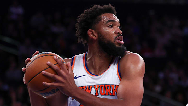 Oct 9, 2024; New York, New York, USA; New York Knicks center Karl-Anthony Towns (32) secures a rebound in front of Washington Wizards guard Bilal Coulibaly (0) during the first half at Madison Square Garden. Mandatory Credit: Vincent Carchietta-Imagn Images