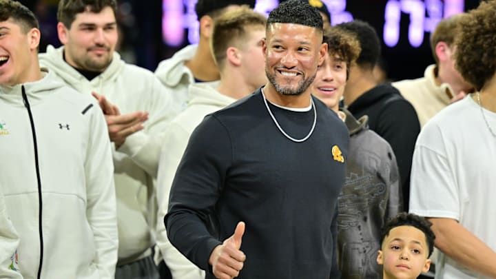 Feb 19, 2025; South Bend, Indiana, USA; Notre Dame head football coach Marcus Freeman and team are honored in the first half of the game between the Notre Dame Fighting Irish and the SMU Mustangs at the Purcell Pavilion. 