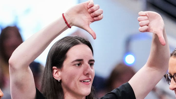 Indiana Fever guard Caitlin Clark jokes with Indiana Fever head coach Stephanie White.
