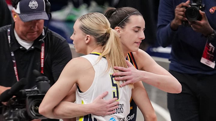 Indiana Fever guard Caitlin Clark (22) and Dallas Wings guard Paige Bueckers (5) hug Sunday, July 13, 2025, ahead of the game at Gainbridge Fieldhouse in Indianapolis.
