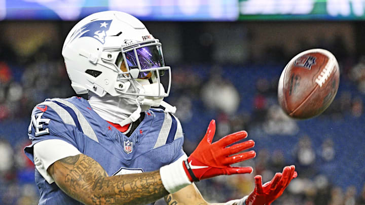 Nov 13, 2025; Foxborough, Massachusetts, USA; New England Patriots cornerback Christian Gonzalez (0) makes a catch during the first half against the New York Jets at Gillette Stadium. Mandatory Credit: Eric Canha-Imagn Images
