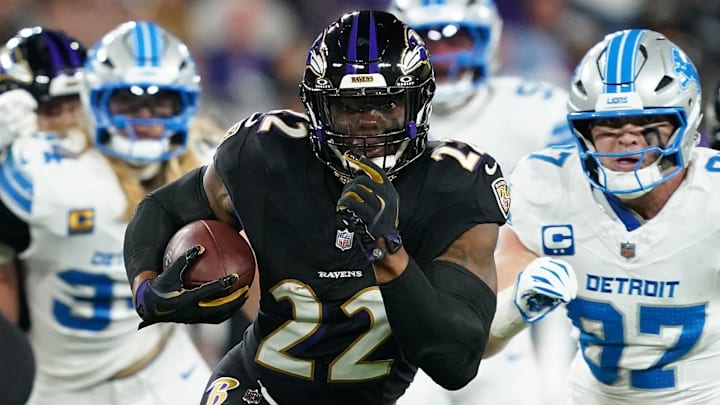 Sep 22, 2025; Baltimore, Maryland, USA; Baltimore Ravens running back Derrick Henry (22) rushes the ball against the Detroit Lions during the first half at M&T Bank Stadium. Mandatory Credit: Mitch Stringer-Imagn Images