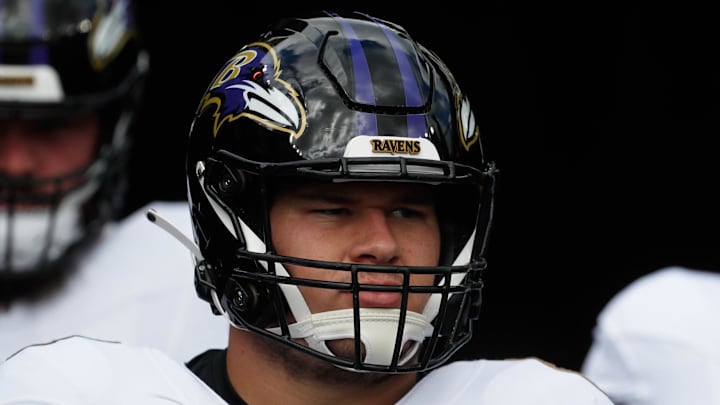 Oct 8, 2023; Pittsburgh, Pennsylvania, USA;  Baltimore Ravens center Tyler Linderbaum (64) takes the field to warm up before the game against the Pittsburgh Steelers at Acrisure Stadium. Mandatory Credit: Charles LeClaire-Imagn Images