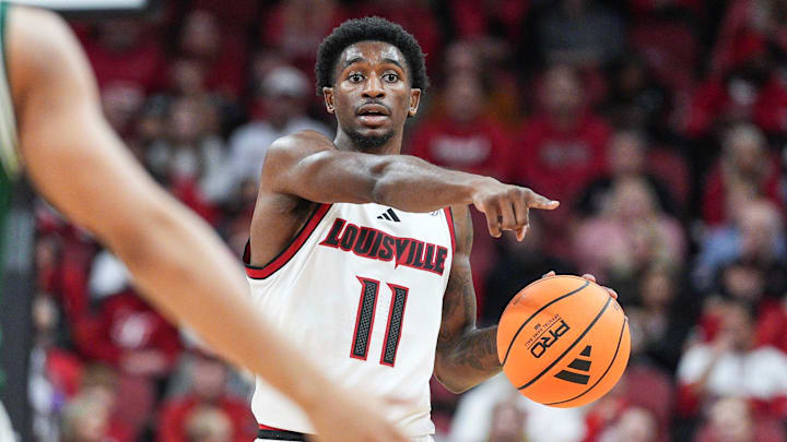Louisville Cardinals guard Kobe Rodgers (11) brings up the ball as the Cards take on Eastern Michigan Nov. 24, 2025 at the KFC Yum! Center in Louisville, Kentucky.