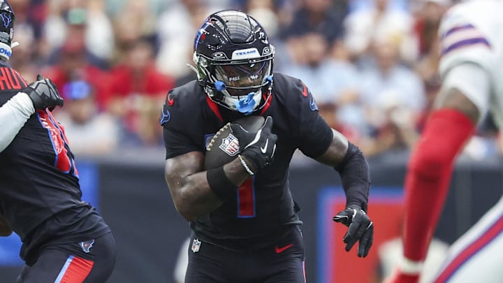 Oct 6, 2024; Houston, Texas, USA; Houston Texans wide receiver Stefon Diggs (1) runs with the ball after a reception during the second quarter against the Buffalo Bills at NRG Stadium. Mandatory Credit: Troy Taormina-Imagn Images