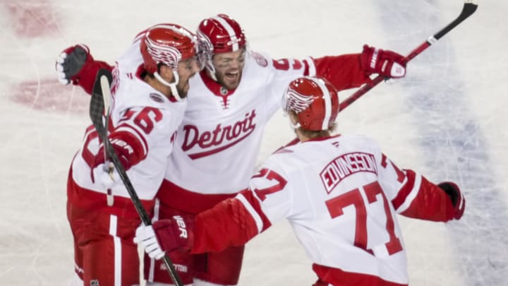 Mar 1, 2025; Columbus, Ohio, USA;  Detroit Red Wings right wing Alex DeBrincat (93) celebrates with teammates after scoring a goal against the Columbus Blue Jackets in the third period at Ohio Stadium. Mandatory Credit: Aaron Doster-Imagn Images