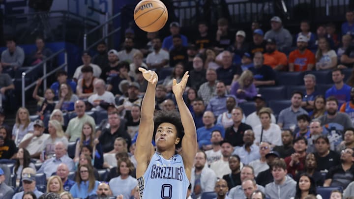 Mar 27, 2025; Oklahoma City, Oklahoma, USA; Memphis Grizzlies forward Jaylen Wells (0) shoots a three point basket over Oklahoma City Thunder forward Jalen Williams (8) during the second half at Paycom Center. Mandatory Credit: Alonzo Adams-Imagn Images