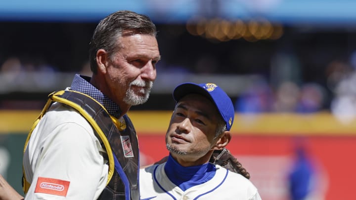 Seattle Mariners former outfielder Ichiro Suzuki poses for a photo with former pitcher Randy Johnson, left, after throwing out the ceremonial first pitch before a game against the Tampa Bay Rays on Aug. 10. 