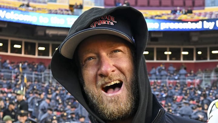 Dec 14, 2024; Landover, Maryland, USA;   Dave Portnoy, Bar Stool Sports  founder and owner  walks along the sidelines before the playing of the 125 Army Navy game at Commanders Field. Mandatory Credit: Tommy Gilligan-Imagn Images

Dec 14, 2024; Landover, Maryland, USA;  Dave Portnoy poses with solders before the between the Army Black Knights and the Navy Midshipmen  at Commanders Field. Mandatory Credit: Tommy Gilligan-Imagn Images