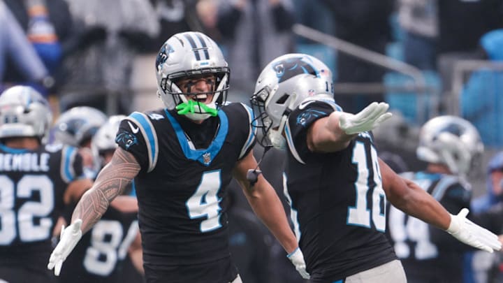 Carolina Panthers wide receiver Tetairoa McMillan (4) celebrates with Carolina Panthers wide receiver Jalen Coker (18) Carolina Panthers wide receiver Tetairoa McMillan (4) celebrates with Carolina Panthers wide receiver Jalen Coker (18)
