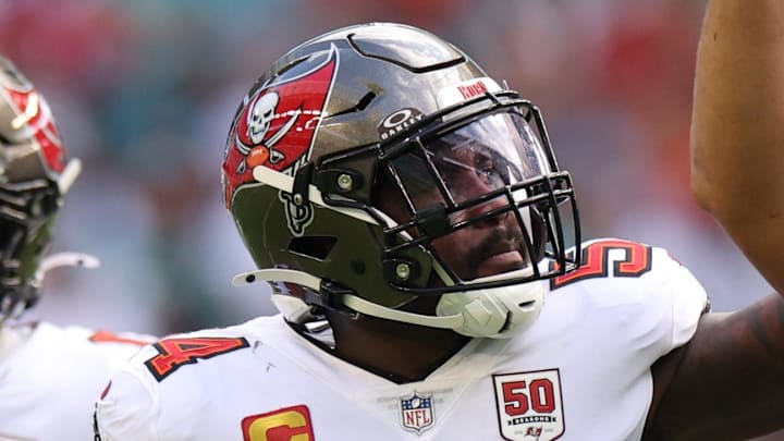 Dec 28, 2025; Miami Gardens, Florida, USA; Tampa Bay Buccaneers defensive end Logan Hall (90) celebrates with linebacker Lavonte David (54) after sacking Miami Dolphins quarterback Quinn Ewers (14, not pictured) during the second quarter at Hard Rock Stadium. Mandatory Credit: Nathan Ray Seebeck-Imagn Images