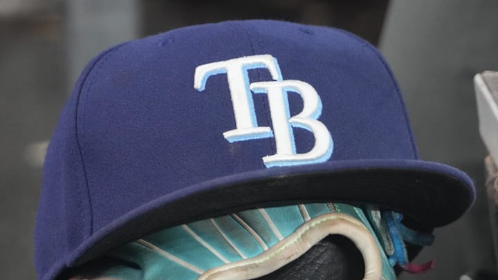 Sep 26, 2025; Toronto, Ontario, CAN; The hat and glove of Tampa Bay Rays third baseman Junior Caminero (13) in the dugout during the game against the Toronto Blue Jays at Rogers Centre. 