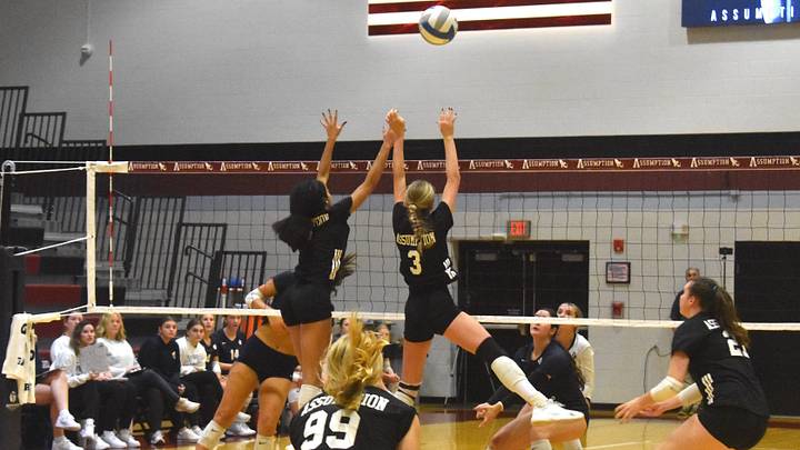Assumption juniors Taylor McKenzie (left) and Julia Lee (right) leap for the block in a match against Notre Dame last season. McKenzie and Lee, along with Brooke Codey (99), should give the Rockets a boost in their quest for another state title. Assumption juniors Taylor McKenzie (left) and Julia Lee (right) leap for the block in a match against Notre Dame last season. McKenzie and Lee, along with Brooke Codey (99), should give the Rockets a boost in their quest for another state title.