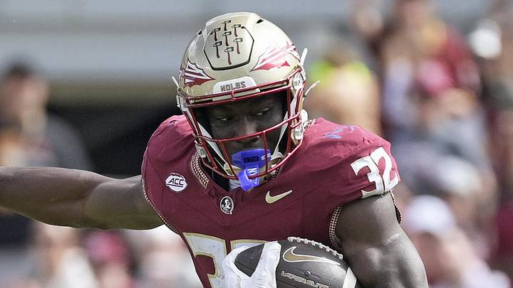 Oct 11, 2025; Tallahassee, Florida, USA; Florida State Seminoles running back Ousmane Kromah (32) is tackled by Pittsburgh Panthers linebacker Braylan Lovelace (0) during the second half at Doak S. Campbell Stadium. Mandatory Credit: Melina Myers-Imagn Images Oct 11, 2025; Tallahassee, Florida, USA; Florida State Seminoles running back Ousmane Kromah (32) is tackled by Pittsburgh Panthers linebacker Braylan Lovelace (0) during the second half at Doak S. Campbell Stadium. Mandatory Credit: Melina Myers-Imagn Images