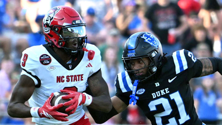 Sep 20, 2025; Durham, North Carolina, USA; North Carolina State Wolfpack wide receiver Terrell Anderson (9) runs the ball during the second quarter against Duke Blue Devils cornerback Landan Callahan (21) at Wallace Wade Stadium. Mandatory Credit: Zachary Taft-Imagn Images Sep 20, 2025; Durham, North Carolina, USA; North Carolina State Wolfpack wide receiver Terrell Anderson (9) runs the ball during the second quarter against Duke Blue Devils cornerback Landan Callahan (21) at Wallace Wade Stadium. Mandatory Credit: Zachary Taft-Imagn Images