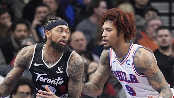 Philadelphia 76ers forward Kelly Oubre Jr. defends against Toronto Raptors forward Brandon Ingram.