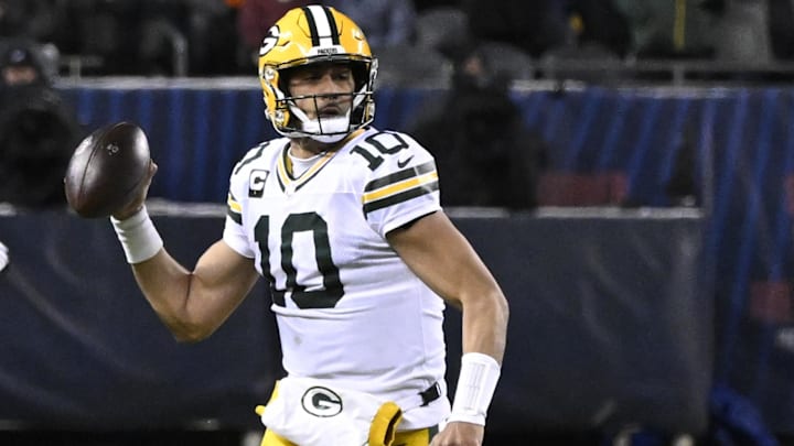 Green Bay Packers quarterback Jordan Love looks downfield as he scrambles against the Chicago Bears.