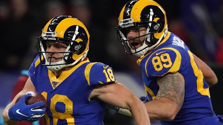 Oct 27, 2019; London, United Kingdom; Los Angeles Rams wide receiver Cooper Kupp (18) is accompanied by tight end Tyler Higbee (89) on a 65-yard touchdown reception in the second quarter against the Cincinnati Bengals  during an NFL International Series game at Wembley Stadium. Mandatory Credit: Kirby Lee-Imagn Images